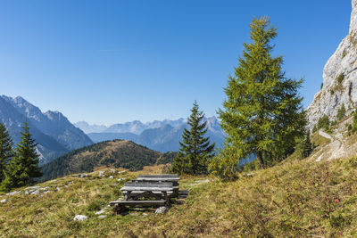 Scenic view of mountains against clear blue sky