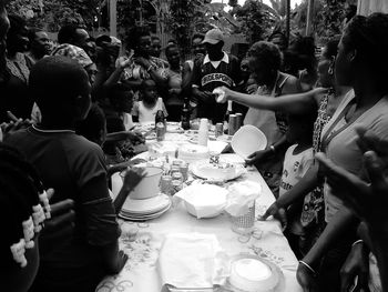 Group of people in market stall