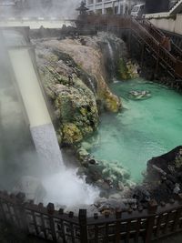 High angle view of waterfall by sea