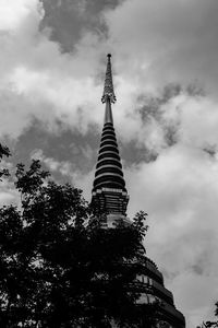 Low angle view of building against cloudy sky