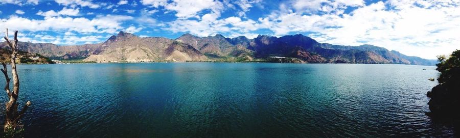 Scenic view of lake against cloudy sky