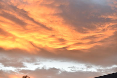 Low angle view of cloudy sky at sunset