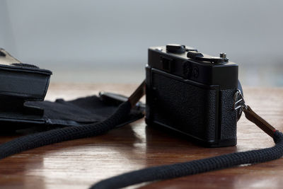 Close-up of camera on table