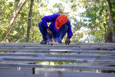 Welding the roof truss.welders working at dangerous heights. welding of steel is very technically 