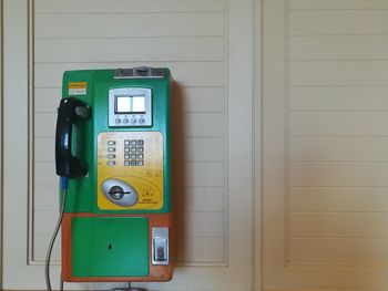 Close-up of telephone booth on wall