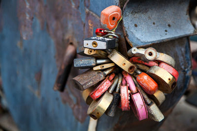 Close-up of red, white and other locks in the form of hearts on the old city bridge