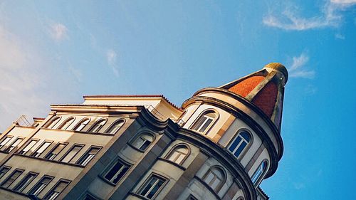 Low angle view of old building against blue sky