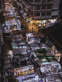 High angle view of illuminated street market at night