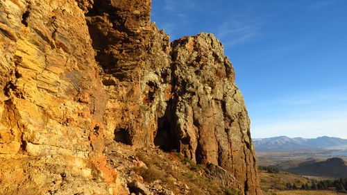 Rock formation on mountain against sky