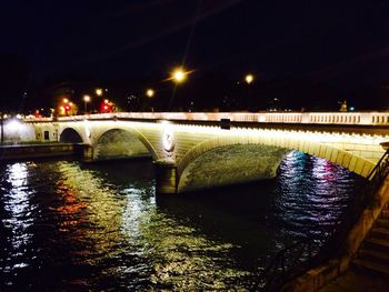 Bridge over river at night