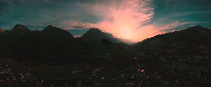 Scenic view of mountains against sky at sunset