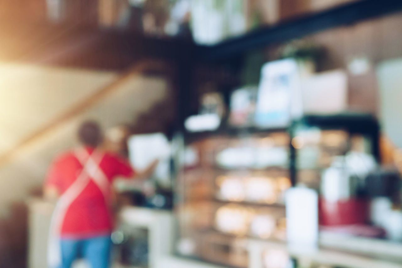 PEOPLE STANDING BY STORE