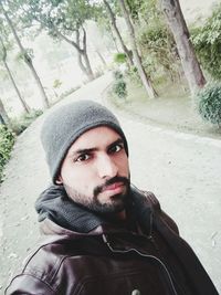 Portrait of young man in park