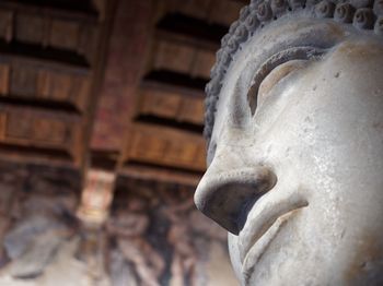 Low angle view of buddha statue in temple