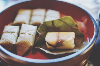 Close-up of sushi in container