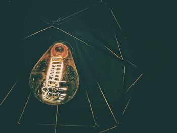 Close-up of illuminated light bulb