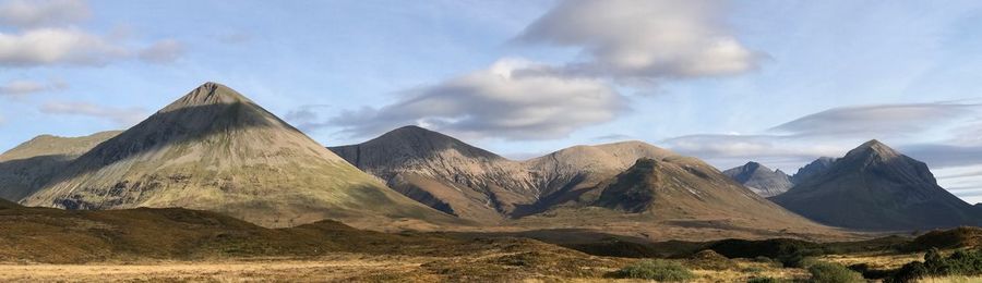 Panoramic view of rocky mountains against sky