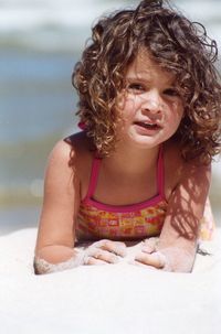 Close-up of smiling girl on beach