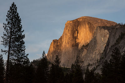 Low angle view of rock formations against sky