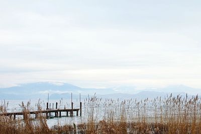 Scenic view of mountains against cloudy sky