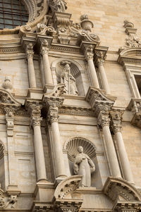 Low angle view of statue of historic building