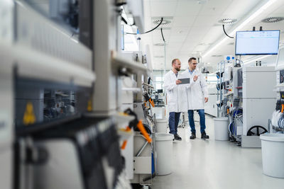 Midsection of scientist working in laboratory