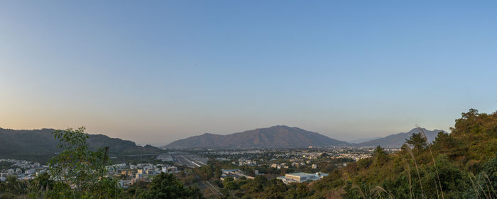 Scenic view of mountains against clear blue sky