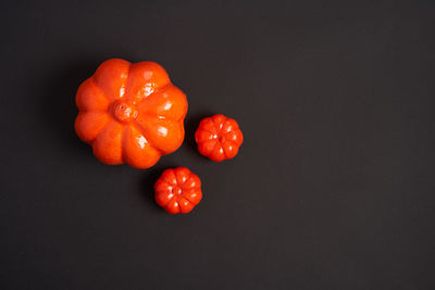 Directly above shot of cherry tomatoes against black background
