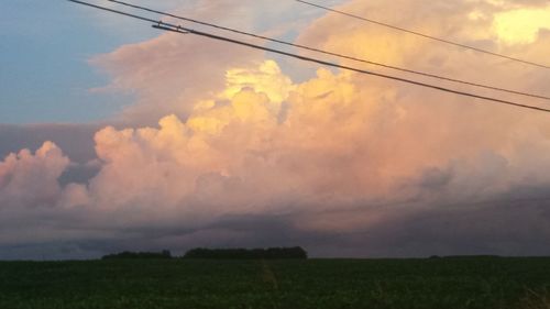 Scenic view of field against sky during sunset