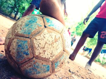 Low angle view of people playing soccer ball