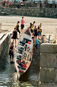 People on boats in canal