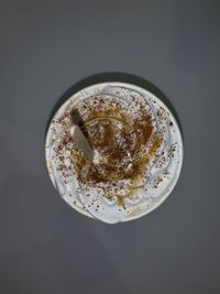 High angle view of coffee cup against black background