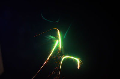 Low angle view of light trails at night