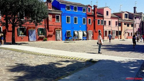 Street by buildings in city