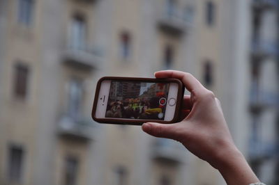 Man photographing through smart phone