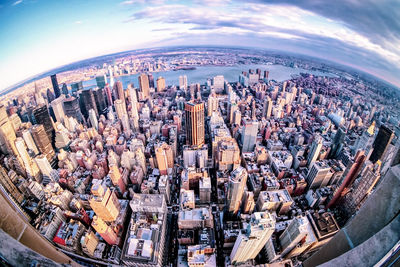 High angle view of modern buildings in city against sky