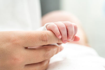 Cropped image of woman holding baby