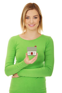 Portrait of a smiling young woman over white background