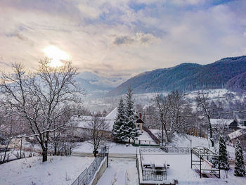 Scenic view of snow covered mountains against sky