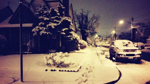 Snow covered road at night