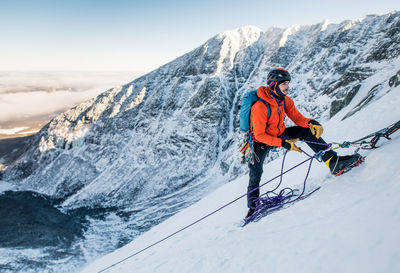 Person standing on snow covered mountain