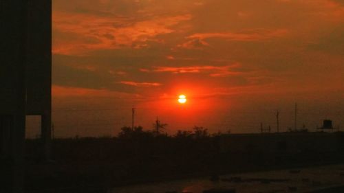 Scenic view of dramatic sky during sunset