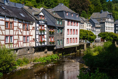 Canal amidst houses in town