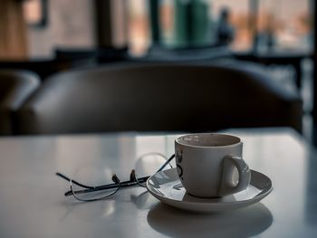 Close-up of coffee cup on table