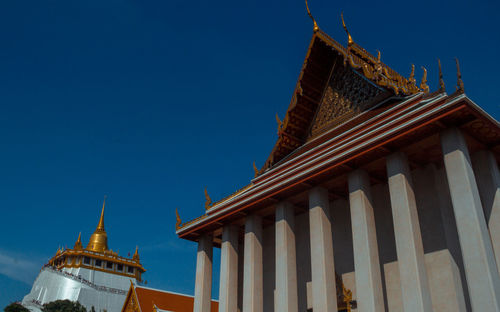 Low angle view of temple against building
