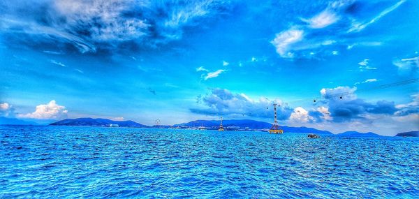 Scenic view of sea against blue sky