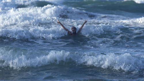 Girl swimming in sea