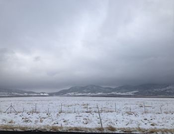 Scenic view of snowcapped mountains against sky