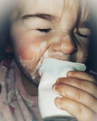 Close-up of a hand holding ice cream