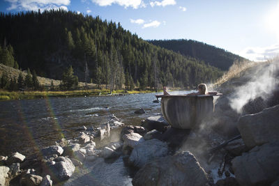 A woman enjoying a dip in the hot springs, idaho